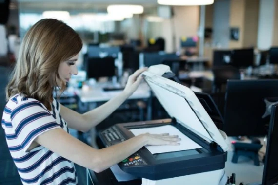 girl uses printer in office