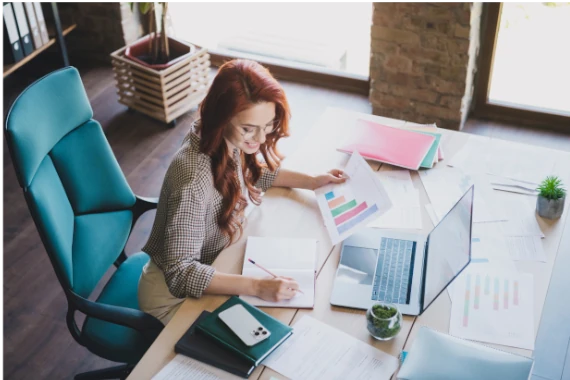 woman look at performance graphics at her desk