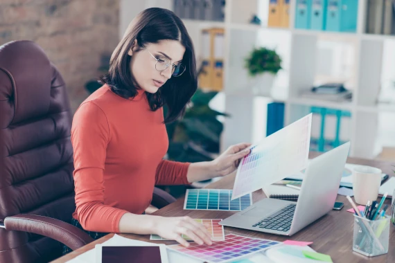 web designer choose colors at her desk