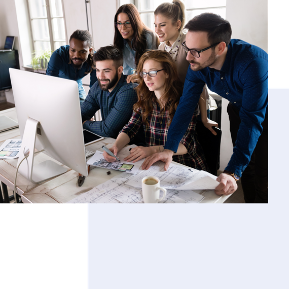 colleagues look at pc screen in office