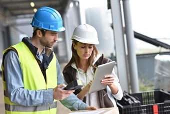 manufacturing workers with tablet  use digital services