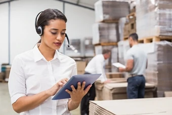 girl uses tablet for warehouse management